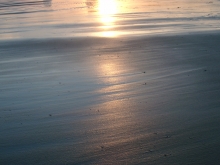 Sandstrand mit Sonnenuntergang